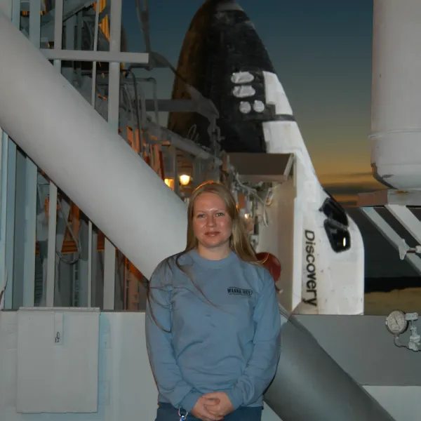 Standing in front of Space Shuttle Discovery on the launch pad